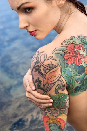 simsearch:400-04450827,k - Back view of sexy nude tattooed Caucasian woman by tidal pool in Maui, Hawaii, USA. Stock Photo - Budget Royalty-Free & Subscription, Code: 400-03925233