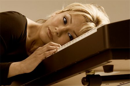 pianist (female) - blonde attractive Latina woman dreaming on piano Stock Photo - Budget Royalty-Free & Subscription, Code: 400-03925362