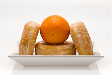 simsearch:400-05106591,k - food choices showing donuts and fruit on plate against a white background Stock Photo - Budget Royalty-Free & Subscription, Code: 400-03927037