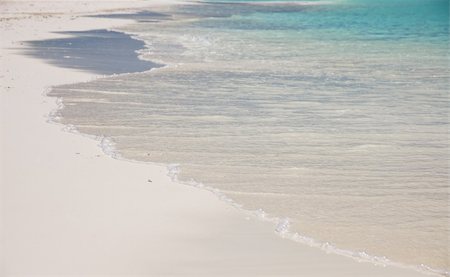 simsearch:628-00919176,k - waves splashing on a white sand beach of an maldivian island Stock Photo - Budget Royalty-Free & Subscription, Code: 400-03928495