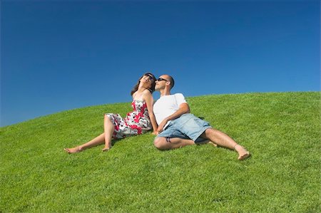 simsearch:400-03934248,k - Beautiful couple of boyfriends relaxing on a beautiful green field Stock Photo - Budget Royalty-Free & Subscription, Code: 400-03928594