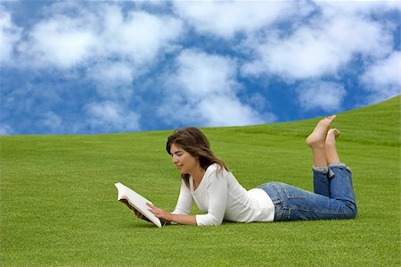 simsearch:400-03934248,k - Beautiful woman lying on the grass and reading Stock Photo - Budget Royalty-Free & Subscription, Code: 400-03928591