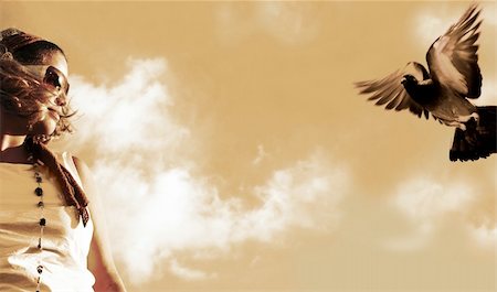 flying bird human hand - Girl watching a flying pigeon - sepia tone Stock Photo - Budget Royalty-Free & Subscription, Code: 400-03929049