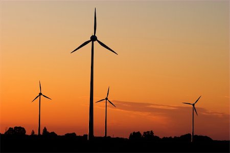 farming generation photography - Four windturbines against dramatic sunset producing environment friendly energy Stock Photo - Budget Royalty-Free & Subscription, Code: 400-03920024