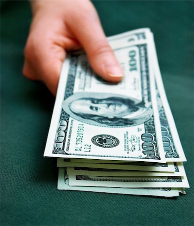 simsearch:400-08891312,k - hand holding some money. Shallow DOF Stock Photo - Budget Royalty-Free & Subscription, Code: 400-03920576