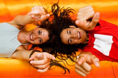 young couple playing on the bed Stock Photo - Budget Royalty-Free & Subscription, Code: 400-03922405
