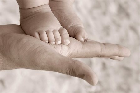 simsearch:859-06808650,k - baby foot on parent hand Stock Photo - Budget Royalty-Free & Subscription, Code: 400-03923266