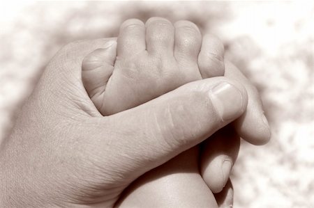 simsearch:859-06808650,k - father holding baby's hand Stock Photo - Budget Royalty-Free & Subscription, Code: 400-03923268