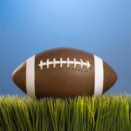 pigskin - Studio shot of football resting in grass. Stock Photo - Budget Royalty-Free & Subscription, Code: 400-03923632