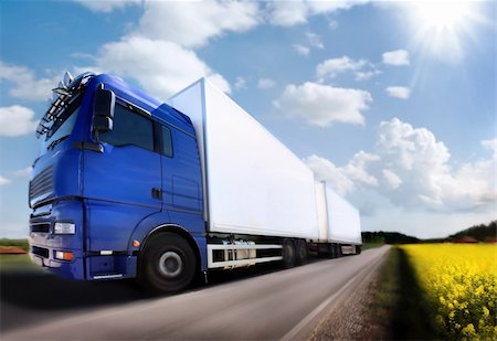 truck driving on country-road/motion Foto de stock - Super Valor sin royalties y Suscripción, Código: 400-03923700
