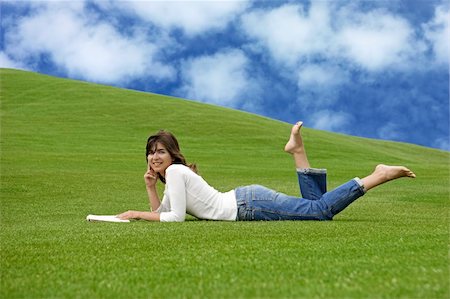 simsearch:400-03934248,k - Beautiful woman lying on the grass and reading Stock Photo - Budget Royalty-Free & Subscription, Code: 400-03934246