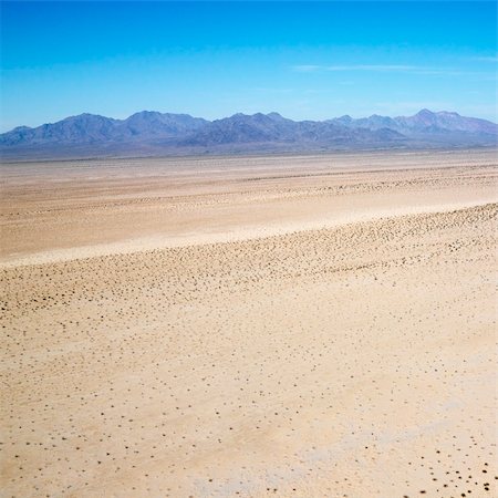 simsearch:400-03948680,k - Aerial view of remote California desert with mountain range in background. Stock Photo - Budget Royalty-Free & Subscription, Code: 400-03935665