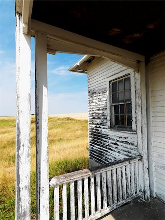 simsearch:700-06397577,k - View from porch of weathered abandoned building in grassland. Photographie de stock - Aubaine LD & Abonnement, Code: 400-03935812