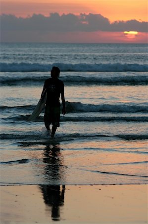 simsearch:400-03992760,k - Surfer at sunset, Kuta beach, Bali Stock Photo - Budget Royalty-Free & Subscription, Code: 400-03936453