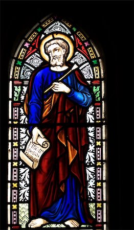 evangelist - detail of victorian stained glass church window in Fringford depicting St Luke the Evangelist, a scroll in his hands with the beginning of his gospel in latin "Fuit in diebus herodes" Stock Photo - Budget Royalty-Free & Subscription, Code: 400-03936977