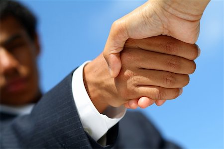 simsearch:640-03262464,k - Business man dressed in suit shaking hands with another person. Concept: Deal done or agreement made. Stock Photo - Budget Royalty-Free & Subscription, Code: 400-03938718