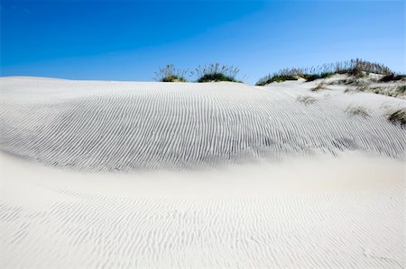 Blues sky with clouds over sandy dunes Stock Photo - Budget Royalty-Free & Subscription, Code: 400-03939087