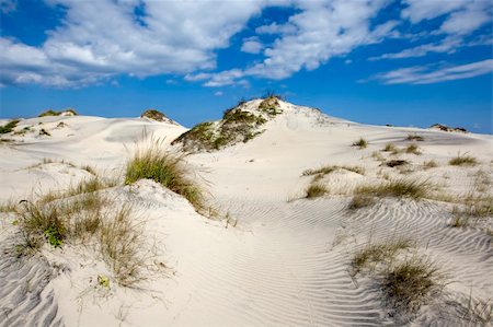 Blues sky with clouds over sandy dunes Stock Photo - Budget Royalty-Free & Subscription, Code: 400-03939089