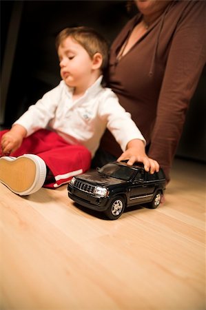 little boy and mother playing indoor with model cars Stock Photo - Budget Royalty-Free & Subscription, Code: 400-03939595
