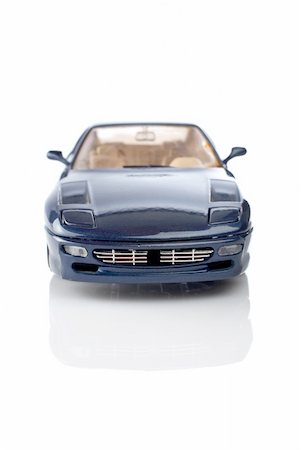 simsearch:400-03927951,k - Blue car reflected on the white background. Focus at front and shallow DOF Stock Photo - Budget Royalty-Free & Subscription, Code: 400-03930923