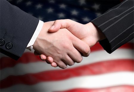simsearch:400-04434336,k - hand shake and a American flag Stock Photo - Budget Royalty-Free & Subscription, Code: 400-03931138