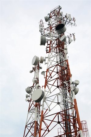 two cellular communication towers on a cloudy day Stock Photo - Budget Royalty-Free & Subscription, Code: 400-03931335