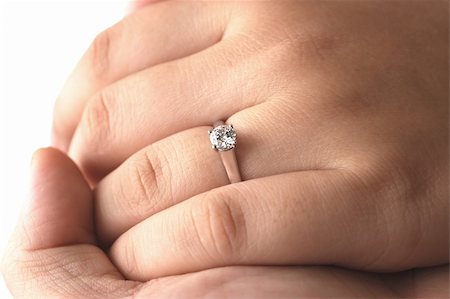 simsearch:694-03783247,k - A man holding his fiance's hand with an engagement ring on Stock Photo - Budget Royalty-Free & Subscription, Code: 400-03932528
