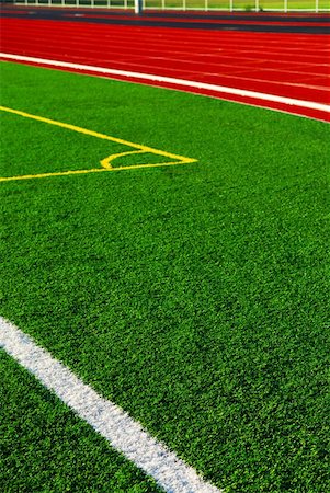 simsearch:633-01715488,k - Red racetrack and green sports field with artificial grass Stock Photo - Budget Royalty-Free & Subscription, Code: 400-03932602