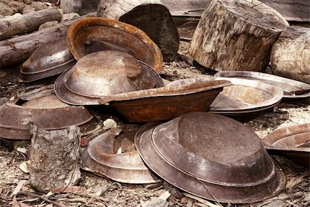 panning (for gold) - failed, pile of gold pans after everyone has given up Stock Photo - Budget Royalty-Free & Subscription, Code: 400-03933132