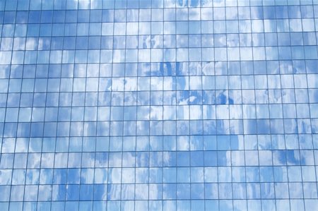 simsearch:614-06624685,k - Glass building detail reflecting the fluffy clouds in the blue sky - background Fotografie stock - Microstock e Abbonamento, Codice: 400-03933803