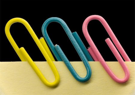 post (display for public view) - Paperclips on a yellow note with black background Stock Photo - Budget Royalty-Free & Subscription, Code: 400-03944376