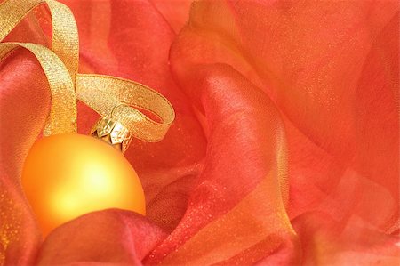 simsearch:614-02241057,k - Christmas Ornaments / Gold ball and ribbon on a red background Stock Photo - Budget Royalty-Free & Subscription, Code: 400-03944595
