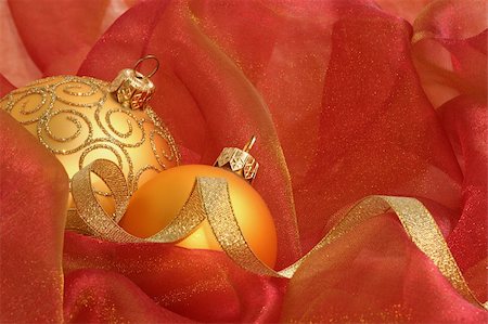 simsearch:614-02241057,k - Christmas Ornaments / Gold balls and ribbon on a red background Stock Photo - Budget Royalty-Free & Subscription, Code: 400-03944596