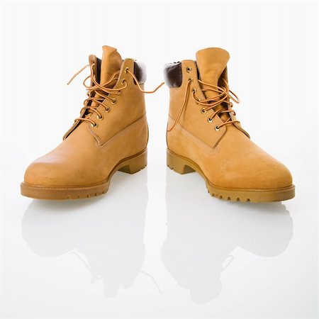 simsearch:700-05973266,k - Pair of tan construction boots. Photographie de stock - Aubaine LD & Abonnement, Code: 400-03944769