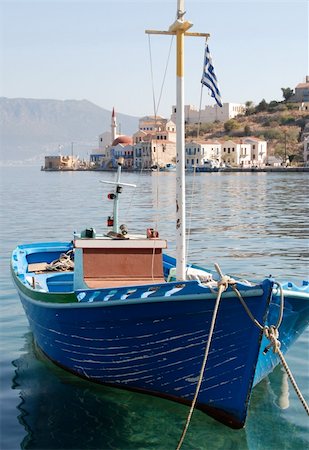 simsearch:400-05254289,k - Single fishing boat inn a greek island marina Stock Photo - Budget Royalty-Free & Subscription, Code: 400-03946029