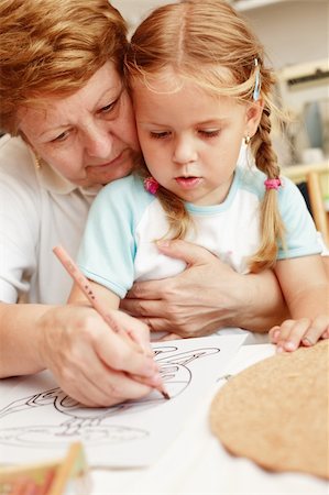 Grandma and grand-daughter painting Stock Photo - Budget Royalty-Free & Subscription, Code: 400-03946607