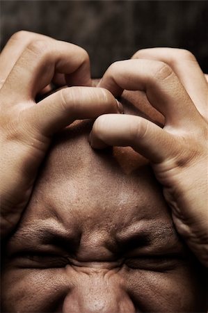 simsearch:695-05780518,k - close up photo of a man having great painful stress and depression Stock Photo - Budget Royalty-Free & Subscription, Code: 400-03947028