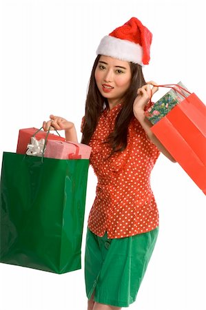 simsearch:622-06190925,k - Asian female in Santa hat with bags full of gifts Stock Photo - Budget Royalty-Free & Subscription, Code: 400-03947297