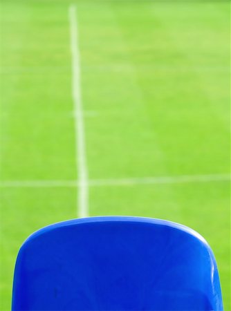 Blue seat and green grass on a soccer stadium Stock Photo - Budget Royalty-Free & Subscription, Code: 400-03947998