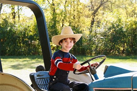 Little Farmer on Driving a Big Tractor Stock Photo - Budget Royalty-Free & Subscription, Code: 400-03948014