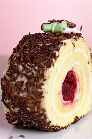 simsearch:400-05173009,k - Raspberry roll cake with chocolate topping Stock Photo - Budget Royalty-Free & Subscription, Code: 400-03948380