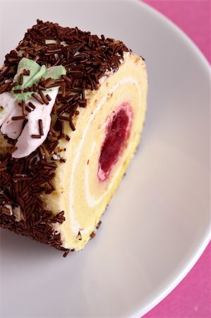 simsearch:400-05173009,k - Raspberry roll cake with chocolate topping Stock Photo - Budget Royalty-Free & Subscription, Code: 400-03948381