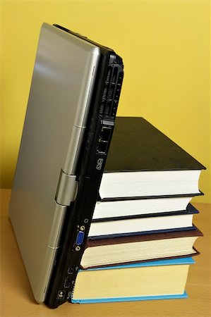 simsearch:700-00195691,k - Stack of books with laptop on the side Photographie de stock - Aubaine LD & Abonnement, Code: 400-03949444