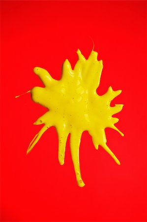 simsearch:400-04477939,k - Yellow paint splashed over Red background Stock Photo - Budget Royalty-Free & Subscription, Code: 400-03949455