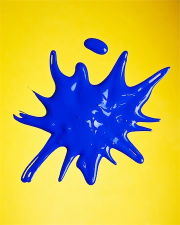 simsearch:400-04477939,k - Blue paint splashed over yellow background Stock Photo - Budget Royalty-Free & Subscription, Code: 400-03949458