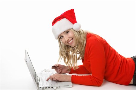 face card - A female using a laptop and shopping online buying  gifts at Christmastime. Photographie de stock - Aubaine LD & Abonnement, Code: 400-03949827