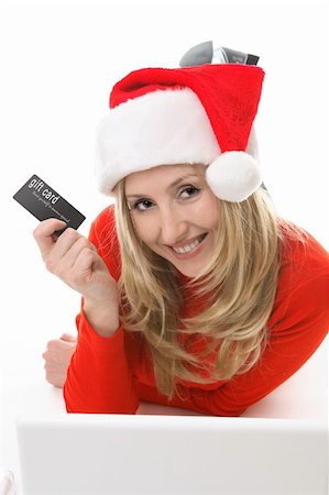 face card - Save your legs.  Blonde santa girl with a gift card or credit card conveniently shopping online.  Add your own card or replace the test with your own design. Photographie de stock - Aubaine LD & Abonnement, Code: 400-03949828