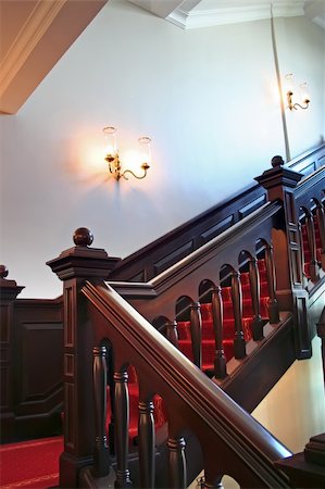 simsearch:700-06038236,k - Wooden stairways with dark wood railings white walls Stock Photo - Budget Royalty-Free & Subscription, Code: 400-03940499