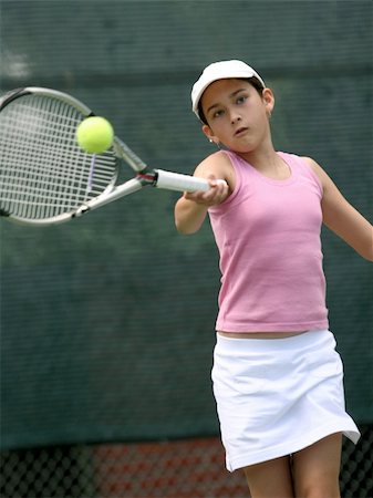simsearch:640-06050635,k - Teenage girl playing tennis Stock Photo - Budget Royalty-Free & Subscription, Code: 400-03940784