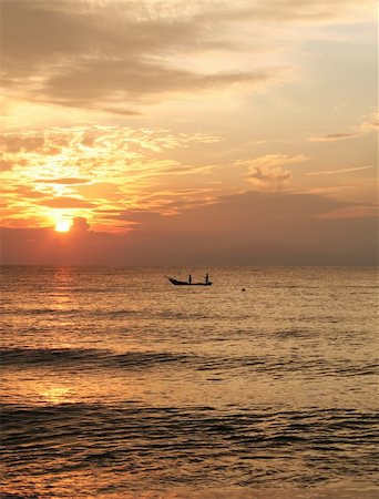 Golden sunrise of the coast of Malaysia with silhouette of fishing boat Stock Photo - Budget Royalty-Free & Subscription, Code: 400-03940841